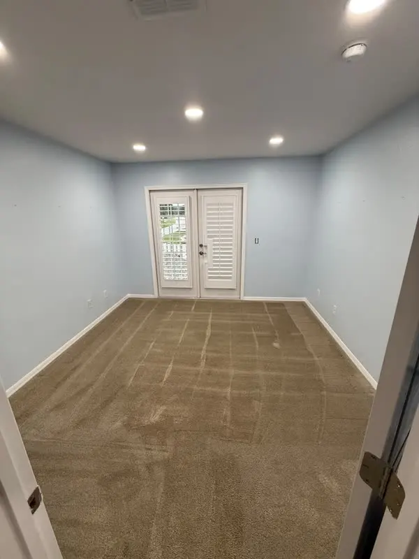 Freshly painted room with french doors
