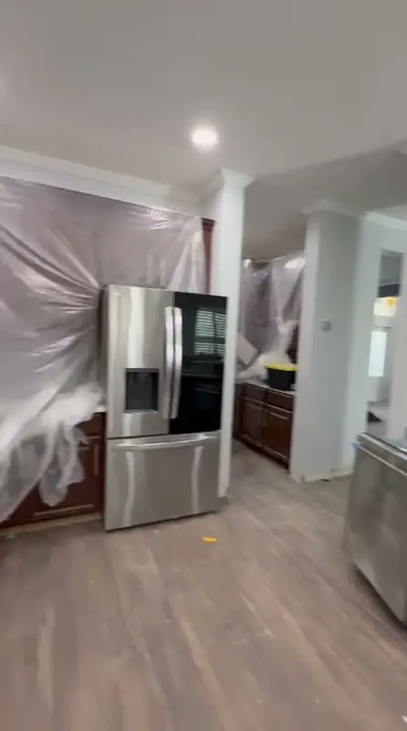 Kitchen covered in protective plastic before remodeling